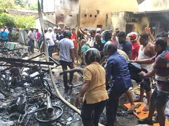 Wreckage is examined at one of the churches that was attacked by a suicide bomber in Sri Lanka. At least 321 people were killed in the attacks