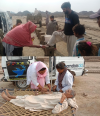 Pakistan lady examining a foot