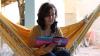 Vangai, a Christian convert from Afghanistan, reads her Bible whilst sitting in hammock in Brazil.