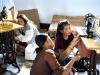 Young Christian women learning how to use sowing machines in South East Asia