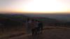 Vangai and her family stand on a hillside looking over the land of Brazil